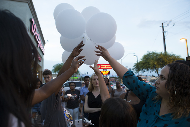 Community members release balloons at a candlelight vigil for the victims of a murder-suicide on Friday, July 1, 2016 in Las Vegas. Loren Townsley/ Las Vegas Review-Journal Follow @LorenTownsley