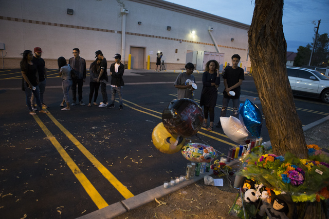 Family and community members pay their respects at a candlelight vigil for the victims of a murder-suicide on Friday, July 1, 2016 in Las Vegas. Loren Townsley/ Las Vegas Review-Journal Follow @Lo ...
