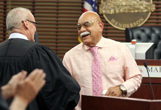 U.S. Army veteran Albert Gutierrez, right, exchanges a smile with Judge Mark Stevens during a Veterans Treatment Court graduation ceremony June 16 in Henderson. Ronda Churchill/View