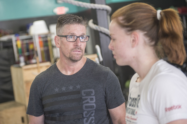 Mike Springer coaches Marya Drabicki, 14, at CrossFit Henderson July 9. Jacob Kepler/View
