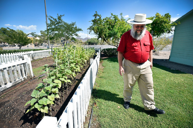 Clark County museums administrator Mark Hall-Patton walks by a garden behind a 1941 Henderson Townsite home during a tour at the Clark County Museum Tuesday, July 26, 2016, in Henderson. David Bec ...