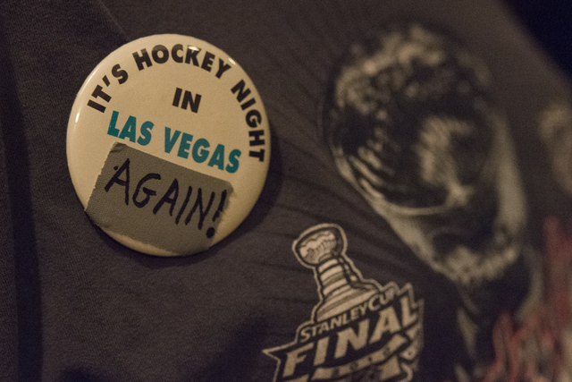 Norm Nusbaum wears a hockey pin at O'Aces Bar & Grill following a conference in which the NHL's Board of Governors approved an expansion franchise in Las Vegas Wednesday, June 22, 2016. The ta ...