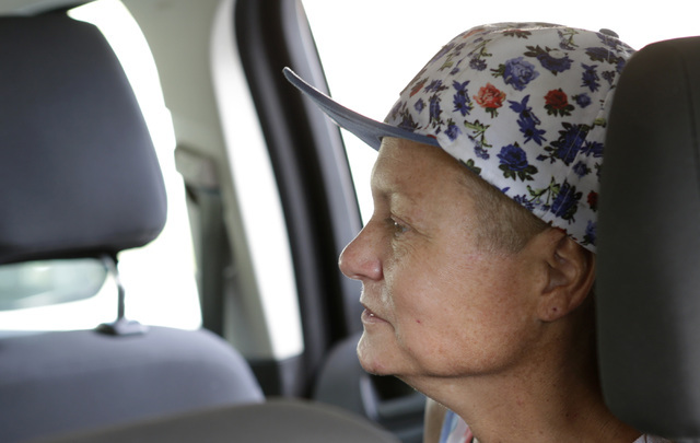 Dawn Louden, homeless Marine veteran, sits in the car as she is ...