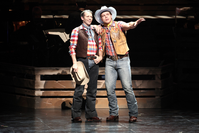 Best pals Slim Johnson (Matt Loehr), left, and Whip Masters (Nathaniel Hackmann) extol the virtues of the spudbusting life in "Idaho! The Comedy Musical," which continues at The Smith Center throu ...