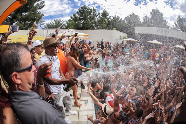 Jamie Foxx sprays Champagne at people at Aria Liquid pool Saturday. (Tony Tran Photography)