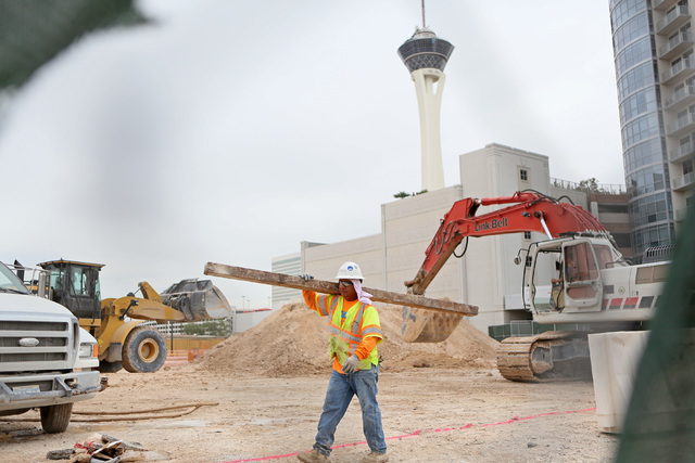 Construction is shown through a fence at the site of Lucky Dragon hotel-casino Friday, May 22, 2015, in Las Vegas. The PENTA Building Group broke ground on the site of the boutique Asian-themed re ...