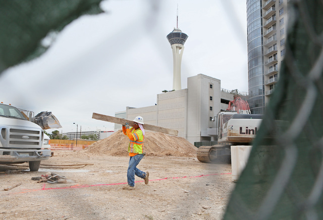Construction is shown through a fence at the site of Lucky Dragon hotel-casino Friday, May 22, 2015, in Las Vegas. The PENTA Building Group broke ground on the site of the boutique Asian-themed re ...