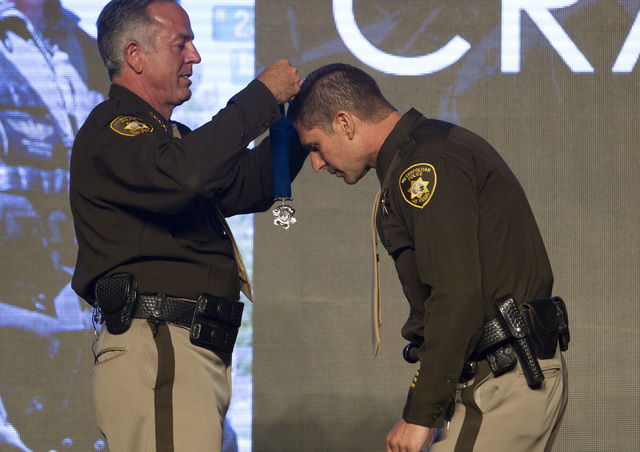 Officer Paul Lourenco, right, receives the Medal of Honor from Sheriff Joe Lombardo during Metroճ fourth annual Best of the Badge Gala held at Red Rock Resort Spa and Casino in the Summerlin area ...