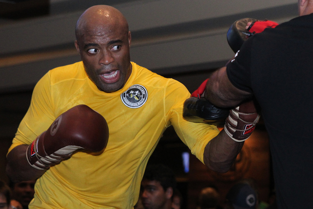 Anderson Silva, left, works out during a promotional event for UFC 183 at MGM Grand casino-hotel Wednesday, Jan. 28, 2015. Silva is scheduled to fight Nick Diaz Saturday at the MGM Garden Arena. ( ...