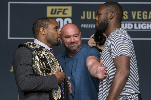 UFC president Dana White, center, watches Daniel Cormier, left, and Jon Jones pose during the UFC 200 press conference at MGM Grand hotel-casino on Tuesday, July 5, 2016, in Las Vegas. Erik Verduz ...