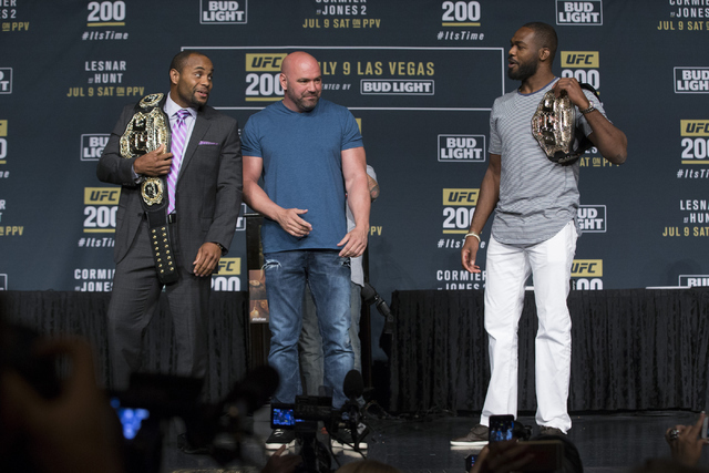 UFC president Dana White, center, watches Daniel Cormier, left, and Jon Jones pose during the UFC 200 press conference at MGM Grand hotel-casino on Tuesday, July 5, 2016, in Las Vegas. (Erik Verdu ...