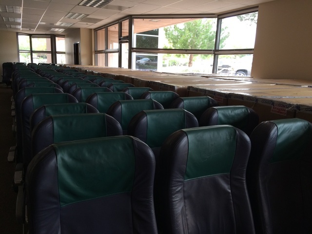 Rows of airlines seats sit May 17 at the space Make-a-Wish will lease from Allegiant Airlines for its new offices. The 7,500-square-foot space will cost the nonprofit $1 a year. Crews will soon co ...