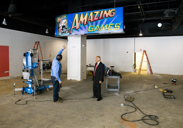 Neonopolis owner Rohit Joshi, right, speaks to building engineer Ricky Quiroga about the installation of a new arcade business on Tuesday, July 12, 2016, in Las Vegas. Benjamin Hager/Las Vegas Rev ...