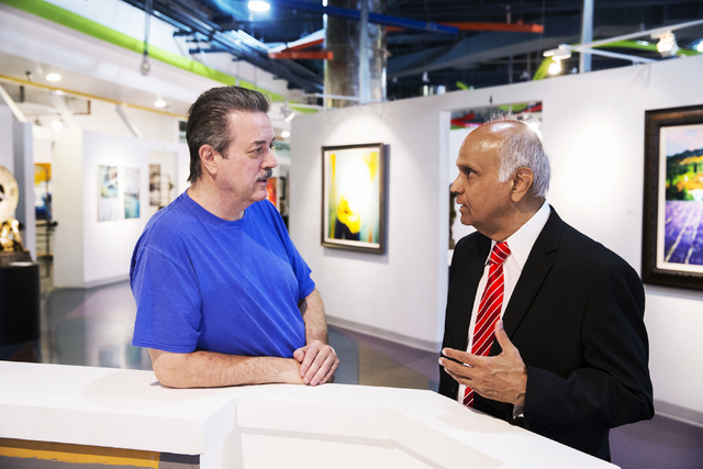 Neonopolis owner Rohit Joshi, right, discusses an upcoming exhibit with Mark Rowland, executive director of the Southern Nevada Museum of Fine Art, on Tuesday, July 12, 2016, in Las Vegas. Benjami ...
