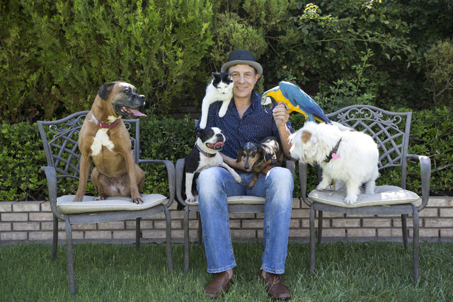 Gregory Popovich poses for a photo with his pets at his North Las Vegas home June 24. Erik Verduzco/View