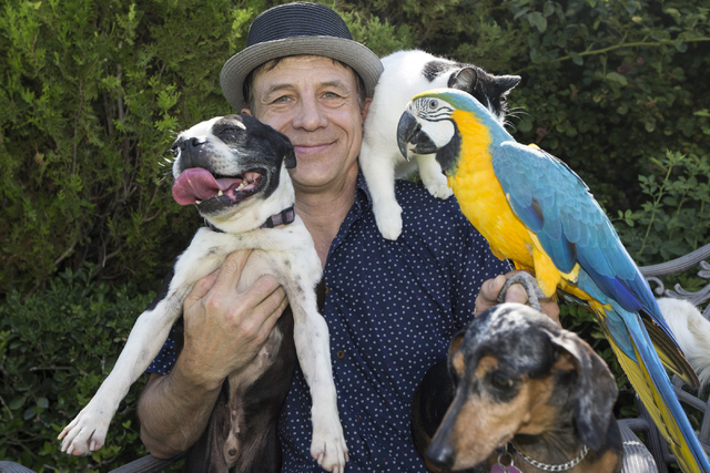 Gregory Popovich, host of The World Famous Popovich Comedy Pet Theater, poses for a photo with his pets at his North Las Vegas home June 24. Erik Verduzco/View Follow @Erik_Verduzco on Twitter