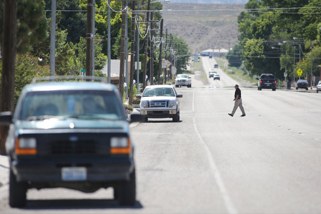 A police officer crosses the road on Thursday, July 14, 2016, toward where a Wednesday night bombing killed one in Panaca, Nevada. (Brett Le Blanc/Las Vegas Review-Journal) Follow @bleblancphoto