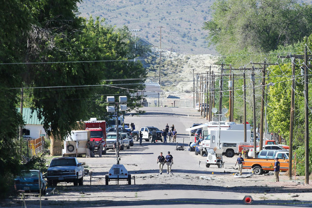 Police investigate shrapnel on Thursday, July 14, 2016, from a Wednesday night bombing that killed one person on Fifth Street in Panaca, Nevada. (Brett Le Blanc/Las Vegas Review-Journal) Follow @b ...