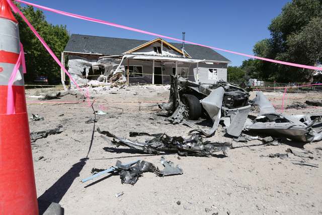 Damage from a Wednesday night bombing that killed one on 5th street in Panaca, Nev., tore a car in half and left a house uninhabitable is seen on Friday, July 15, 2016. Brett Le Blanc/Las Vegas Re ...