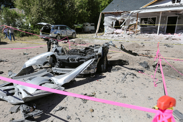 Damage from a Wednesday night bombing that killed one person on 5th street in Panaca, Nev., tore a car in half and left a house uninhabitable, is seen on Friday, July 15, 2016. (Brett Le Blanc/Las ...