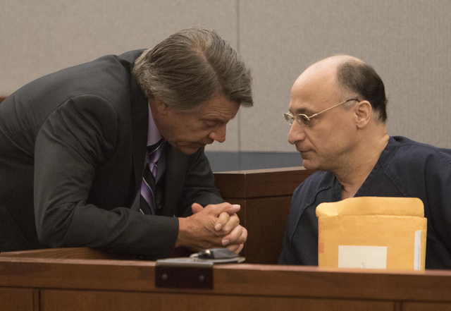 Mark Picozzi, right, a New Jersey man convicted of raping and robbing escorts, speak to attorney Michael Schwarz as he waits in court for his sentencing at the Regional Justice Center in downtown  ...