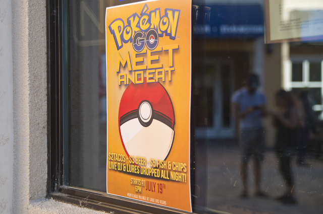 A sign advertises a Pokemon Go &quot;Meet and Eat&quot; event at Lake Las Vegas on Tuesday, July 19, 2016. The event was organized by Chanthy Walsh who owns two restaurants inside The Vill ...