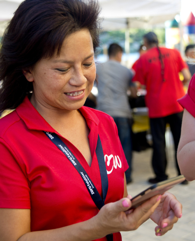 Chanthy Walsh uses the Pokemon Go app during a Pokemon Go &quot;Meet and Eat&quot; event at Lake Las Vegas on Tuesday, July 19, 2016. The event was organized by Walsh who owns two restaura ...