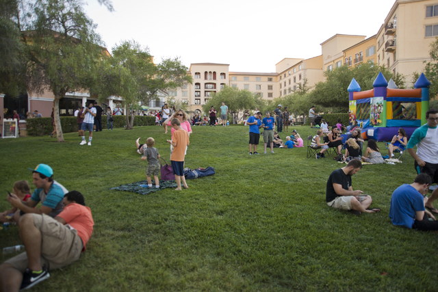 Visitors spread out on the lawn during a Pokemon Go &quot;Meet and Eat&quot; event at Lake Las Vegas on Tuesday, July 19, 2016. The event was organized by Chanthy Walsh who owns two restau ...