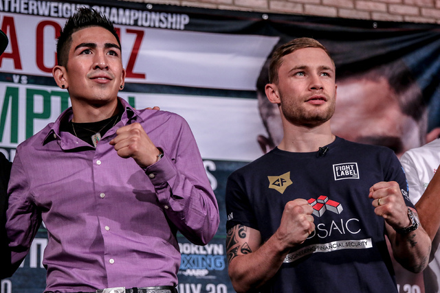 Leo Santa Cruz, left, and Carl Frampton pose for photos during their final news conference Thursday in Brooklyn, New York. Frampton hopes to bring back the WBA featherweight belt to his homeland o ...
