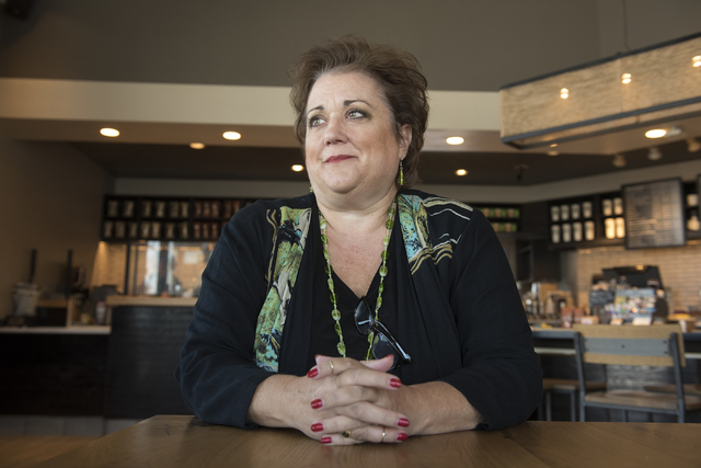 Julie Davies talks to a reporter during an interview regarding the city's licensing and zoning regulations on short-term residential rentals from a Starbucks on North Rancho Drive in Las Vegas, on ...