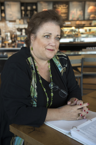 Julie Davies talks to a reporter during an interview regarding the city's licensing and zoning regulations on short-term residential rentals from a Starbucks on North Rancho Drive in Las Vegas, on ...