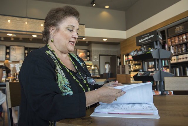 Julie Davies talks to a reporter during an interview regarding the city's licensing and zoning regulations on short-term residential rentals from a Starbucks on North Rancho Drive in Las Vegas, on ...