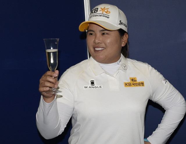 Jun 9, 2016; Sammamish, WA, USA; Inbee Park celebrates with a glass of champagne as she is honored for becoming eligible for the LPGA Hall of Fame after the first round of the KPMG Women's PGA Cha ...