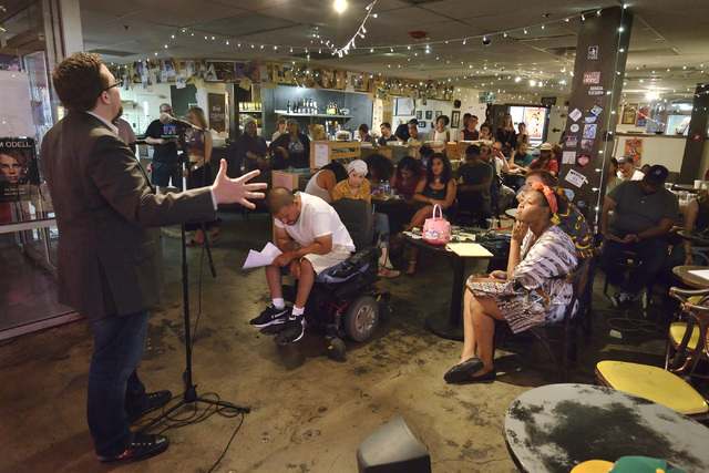 John Irenicus, left, performs during a poetry slam sponsored by the Battle Born slam poetry team at The Beat Coffeehouse and Records at 520 Fremont St. in Las Vegas on Friday, July 22, 2016. Bill  ...