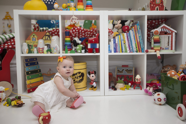 Miliah Ramso, 11 months, daughter of interior designer Jannicke Ramso, owner of Tiny Little Pads, sits inside her sister's room designed by her mother April 12. Erik Verduzco/View file photo