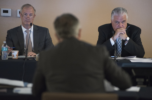 Southern Nevada Tourism Infrastructure Committee members Steve Hill, left, and Steve Sisolak, right, listen to Clark County Sheriff Joseph Lombardo, center, during a meeting about financing additi ...