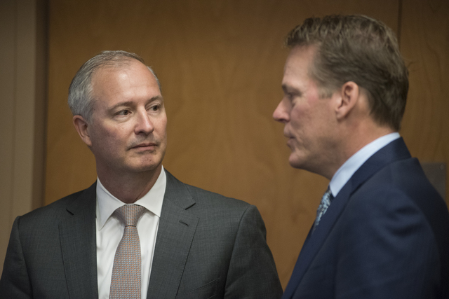 Developer for Majestic Realty Craig Cavileer, right, speaks to Steve Hill, chairman of the Southern Nevada Tourism Infrastructure Committee, during a meeting about potential stadium sites at the U ...