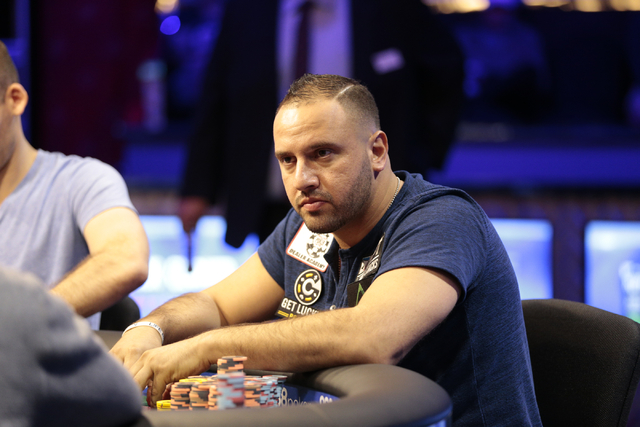 Poker player Michael Mizrachi stares across the table at an opponent, during the $50,000 buy-in Poker Players' Championship at the Rio Convention Center in Las Vegas on Wednesday, July 6, 2016. (D ...