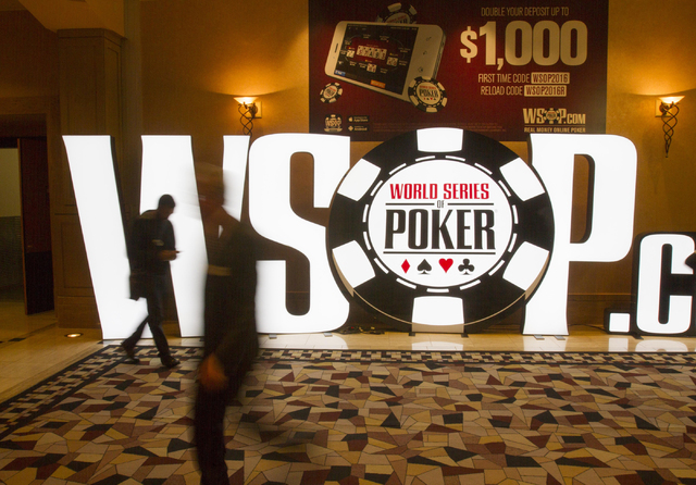 People walk past a WSOP sign during Day 4 of the Main Event of the World Series of Poker at the Rio Convention Center in Las Vegas on Friday, July 15, 2016. Richard Brian/Las Vegas Review-Journal  ...