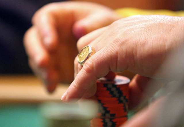 Alan Cutler, of Vernon Hills, Ill., stacks chips while playing in the $1,000 buy-in Seniors No-limit Holdեm at the 47th annual World Series of Poker at the Rio Convention Center Sunday, June ...