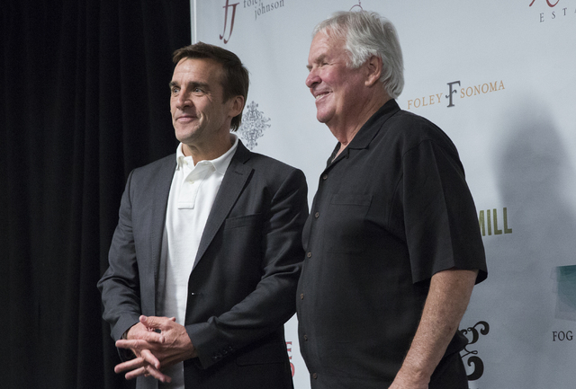 Bill Foley, right, owner of Las Vegas’ NHL expansion team, poses for photos with George McPhee, the team's new general manager, at T-Mobile Arena on Wednesday, July 13, 2016, in Las Vegas. (Benj ...