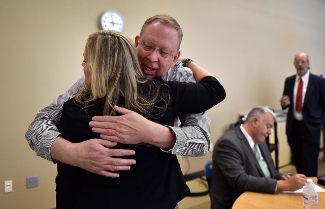 Sally Calloway, left, trainer with the Platform to Employment program receives a hug from Robert Barclay after his graduation from the five-week program designed to help veterans return to work du ...