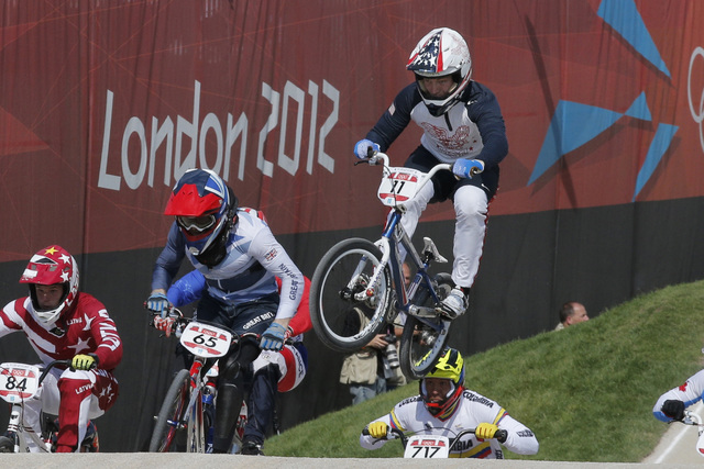 The United States' Connor Fields (11) leads the competition in a BMX cycling men's quarterfinal run during the 2012 Summer Olympics in London, Aug. 9, 2012. (Christophe Ena, File/AP)