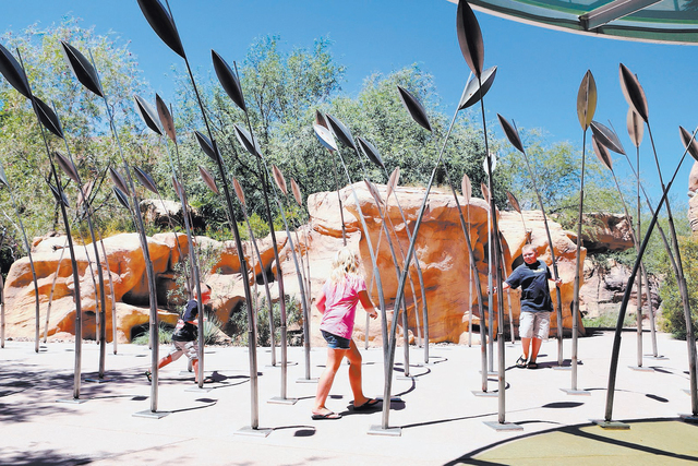 Jake Donaldson, from right, his sister, Jenna, and brother, Hank play at a sculpture while visiting the Springs Preserve in this photo from 2015. (BIZUAYEHU TESFAYE/LAS VEGAS REVIEW-JOURNAL FILE)