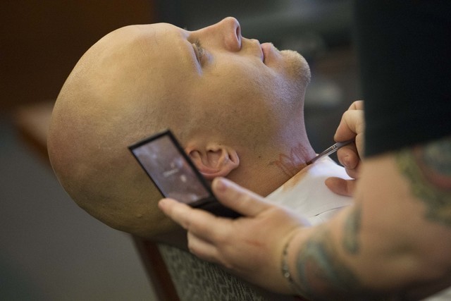 Bayzle Morgan appears before Judge Richard Scotti at the Regional Justice Center in Las Vegas on July 21, 2016, left, and after a courtroom makeup artist covered his tattoos with makeup for his tr ...