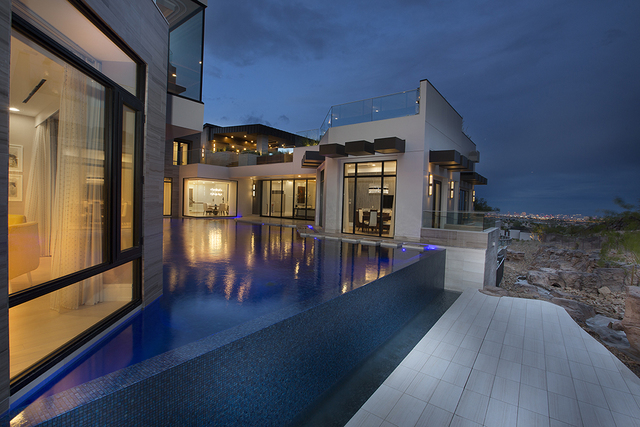 The home surrounds the pool.  Courtesy of Shapiro & Sher Group