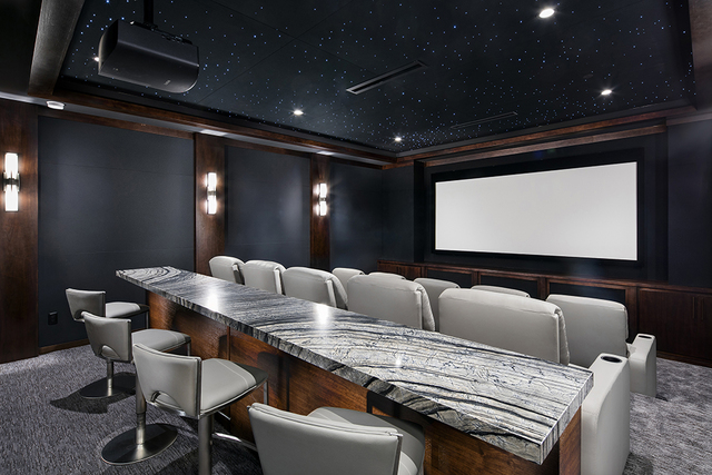 The home theater features 10 cushioned seats and four bar stools. (Courtesy of Shapiro & Sher Group)