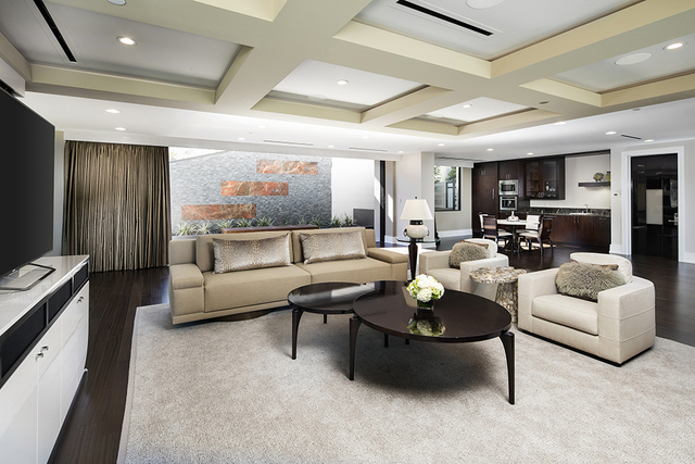 The master bedroom lounge area, which is located on the first floor of the three-floor suite, has seating, a television and kitchenette. (Courtesy of Shapiro & Sher Group)