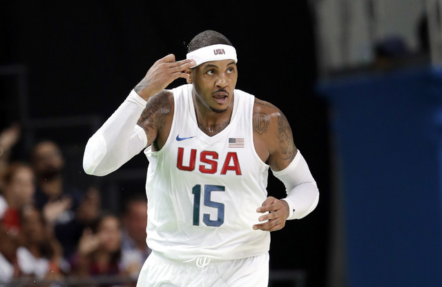 United States' Carmelo Anthony (15) signals ager make a score against Venezuela during a men's basketball game at the 2016 Summer Olympics in Rio de Janeiro, Brazil, Monday, Aug. 8, 2016. (AP Phot ...