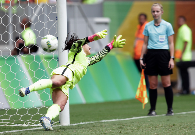 United States goalkeeper Hope Solo fails to stop a penalty during a penalty shoot-out in the quarter-final match of the women's Olympic football tournament between the United States and Sweden in  ...